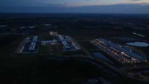 Meta data hub glowing after sunset, aerial drone photo. Stock Footage 318620432