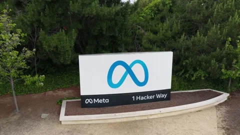 Meta headquarters sign with blue infinity logo and address 1 Hacker Way Stock Footage 335987252