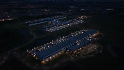 Meta technology campus glowing at nightfall, drone perspective. Stock Footage 318287762