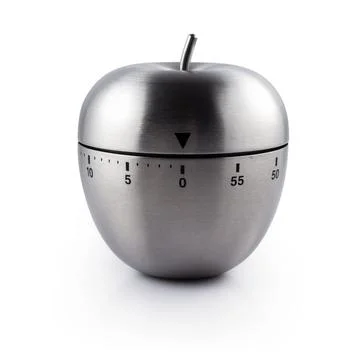 Metal apple kitchen timer on white background Stock Photos