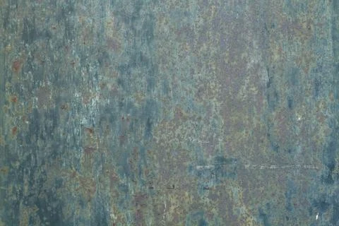 A metal background with paint in poor condition and rust in a close up view Foto stock
