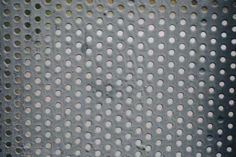 Metal background pattern with bstract metal texture plate hole. Stock Photos