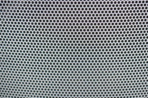 Metal background pattern with bstract metal texture plate hole. Stock Photos