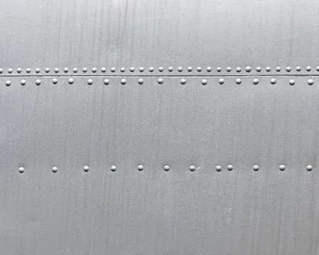 Metal background with rivets Stock Photos