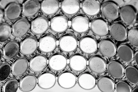 Metal background with round elements. Stock Photos