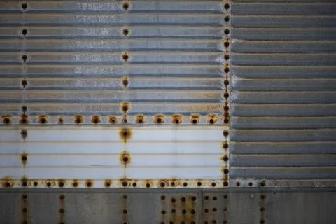 Metal background with rust texture. Metal background features riveted steel.. Stock Photos