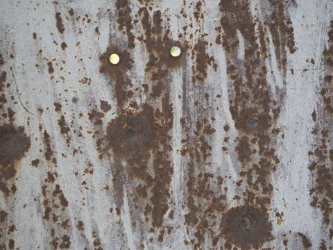 Metal background worn with rust and holes Stock Photos