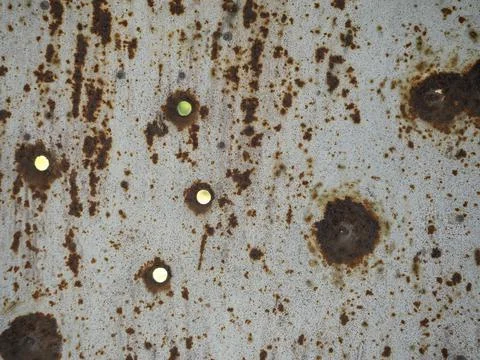 Metal background worn with rust and holes Stock Photos