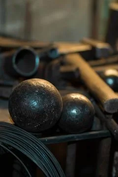 Metal balls on the table in the workshop Stock Photos