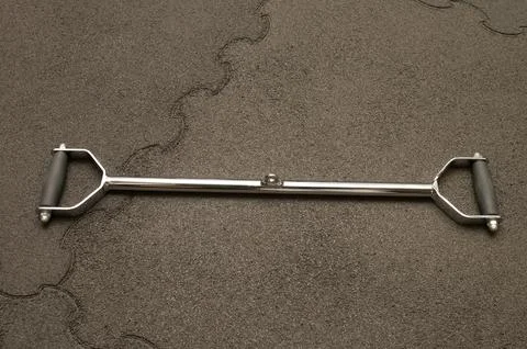 Metal bar handle on asphalt surface with grips Stock Photos