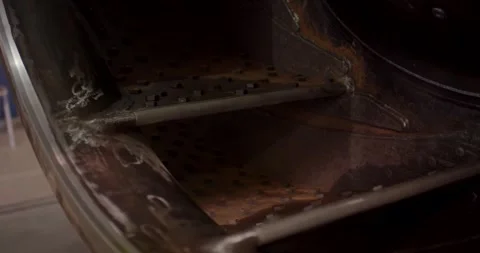 Metal Bar on Perforated Plate in a Machine, Dark Industrial Detail, Close Up Stock Footage 340356980