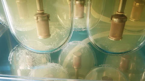 Metal Barrels are Spinning while Placed into Glass Test Tube in the laboratory 스톡 동영상 246831445