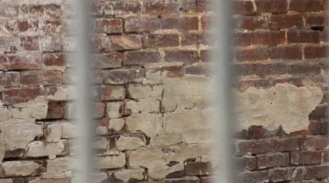 Metal bars with brick background Stock Footage 33756802