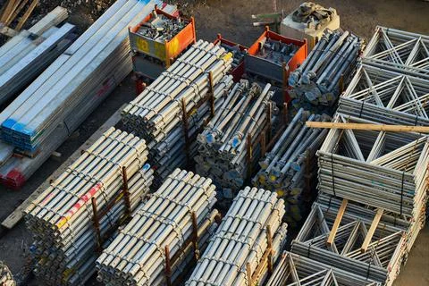 Metal bars, frames and construction equipment on a building site Stock Photos