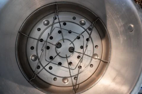 Metal basket for canning jars in the bottom of pressure cooker Foto stock