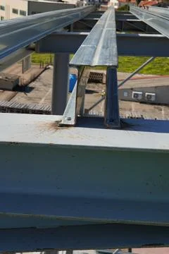 A metal beam with a profiled surface. 스톡 사진