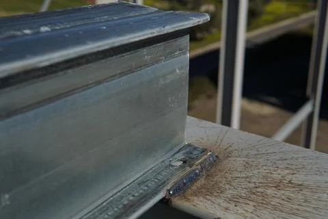 A metal beam with a profiled surface. Photos