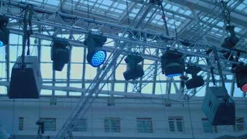 A metal beam under the ceiling with many lamps and spotlights for stage lighting Stock Footage 323943019