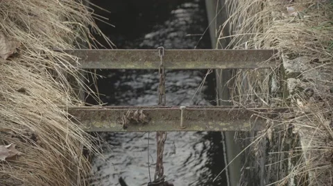 Metal beams over stream Stock Footage 58908042