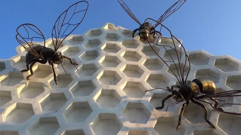 Metal bees on marble comb composition Stock Footage 95641061