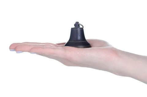 The metal bell in hand Stock Photos