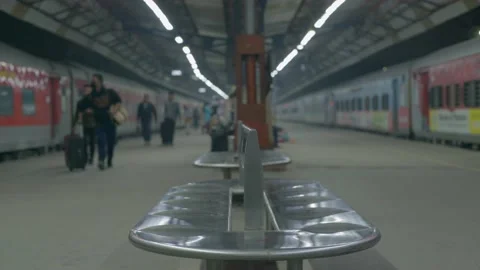 Metal bench and train standing the both side on platform Video stock 228197047