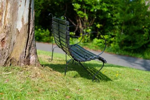 Metal bench in a park. 스톡 사진