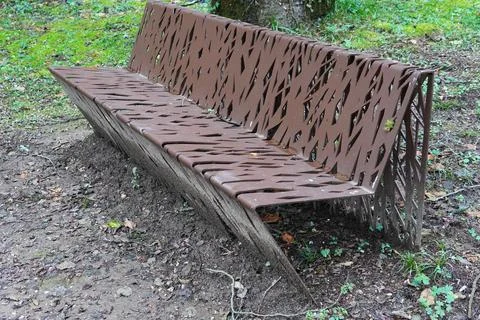 Metal benches, laser cut with patterns and geometric shapes. 스톡 사진