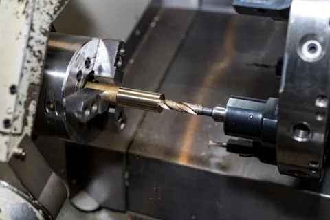 Metal blank machining process on lathe with cutting tool Stock Photos
