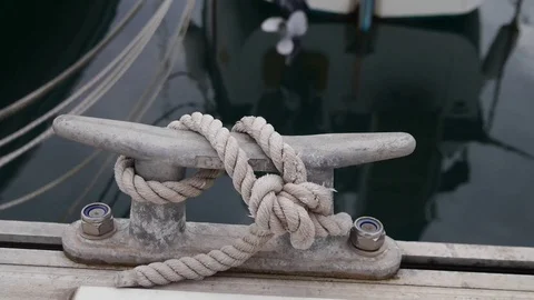 Metal bollard detail and ropes in marina Stock Footage