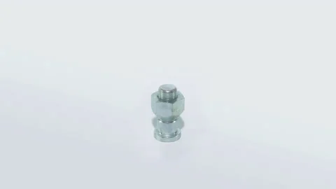 The metal bolt rotates on a white backgr... | Stock Video | Pond5