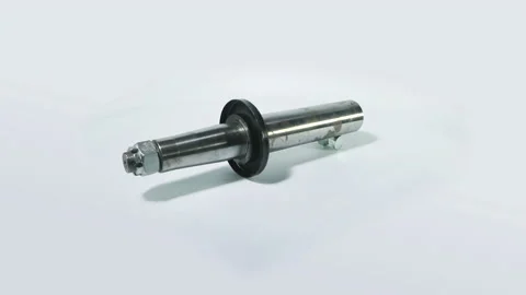 The metal bolt rotates on a white backgr... | Stock Video | Pond5