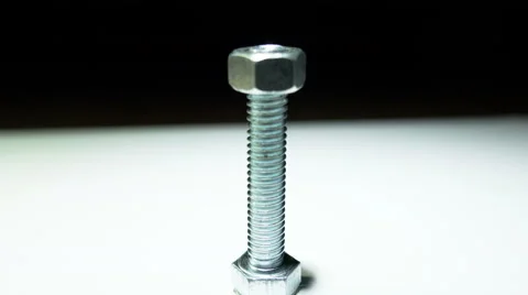 Metal bolt with two  turned  nut. 4K  close up screwshot Stockbeeldmateriaal 61796611