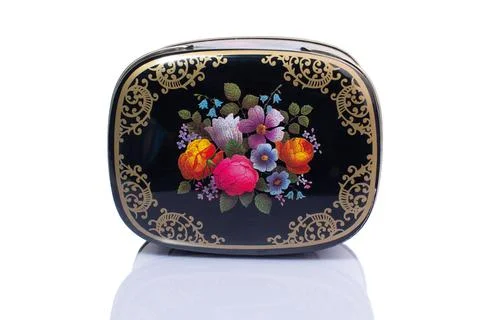 Metal box with flowers pattern isolated on white background Stock Photos