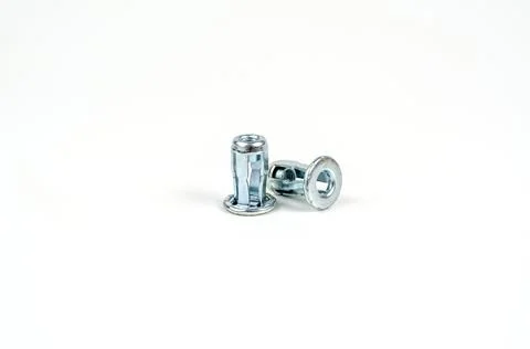 Metal brackets for self-tapping screws. Close up. Isolated on white backgroun Stock Photos