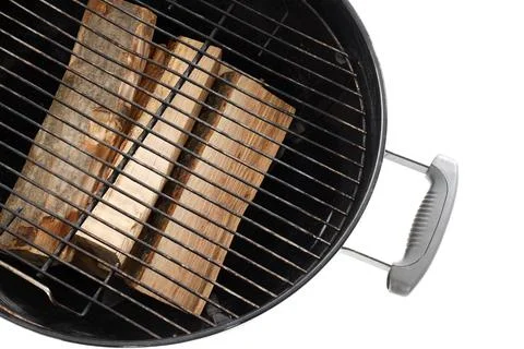 Metal brazier with firewood on white background, top view Stock Photos