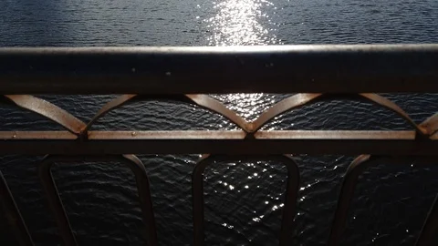 Metal bridge and river. Railing old metal bridge. Rusty iron bridge. Stock Footage 106448645