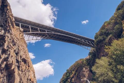 Metal bridge construction above the gorge. Armenian canyon picturesque view. Stock Photos