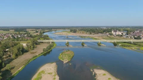A metal bridge spanning the Loire River in Sully-sur-Loire, France, aerial view. Stock Footage 346713870