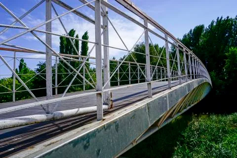 Metal bridge of white color on the river carrion in the city of Palencia Stock Photos