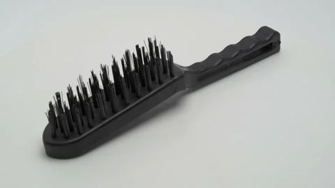 Metal brush on a white background Видео 265416615