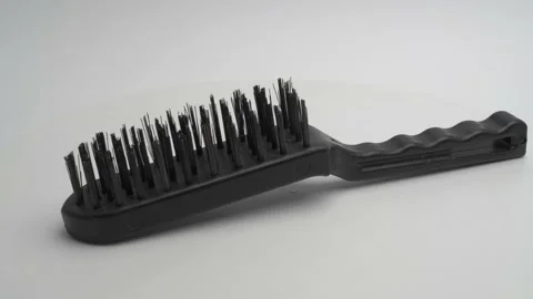Metal brush on a white background Видео 265867269