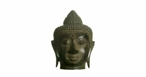 Metal Buddha's Head Rotating 360 Degrees Over White Background Stock Footage 137448100