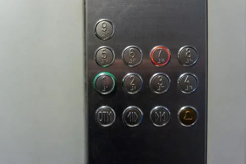 Metal buttons 1 to 9 of the elevator close-up Stock Photos