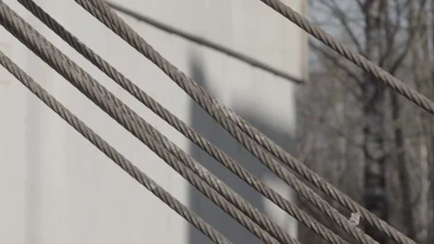 Metal cables, construction site, trees Stock Footage 275336322