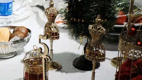  metal cages are on the table Table decorations in the form of gold Stock Footage 122667806