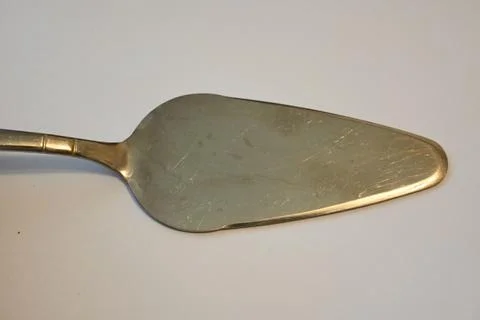 Metal cake server on a white background Foto stock