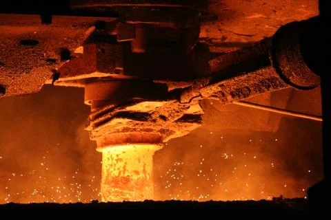 Metal casting process with high temperature fire in metal parts factory Stock Photos