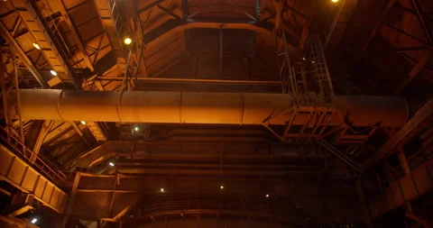 Metal casting process in metallurgical plant. Liquid metal pouring into molds Stock Footage 231003203