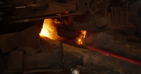 Metal casting process in metallurgical plant. Liquid metal pouring into molds Video stock 231004699
